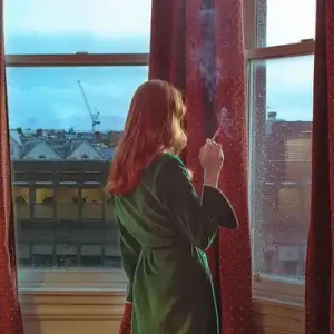 Woman Smoking At The Window Preisreduziert